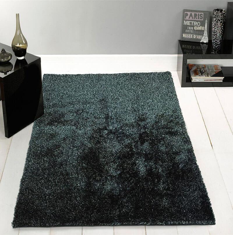 Fuzzy Two Tone Black Ash Area Rug showcasing a soft shaggy texture in black and rust colors, perfect for enhancing home decor.