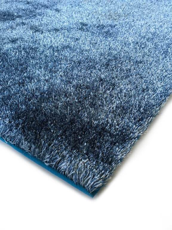 Fuzzy Two Tone Blue Area Rug showcasing a soft shaggy texture and vibrant blue color, perfect for home decor.