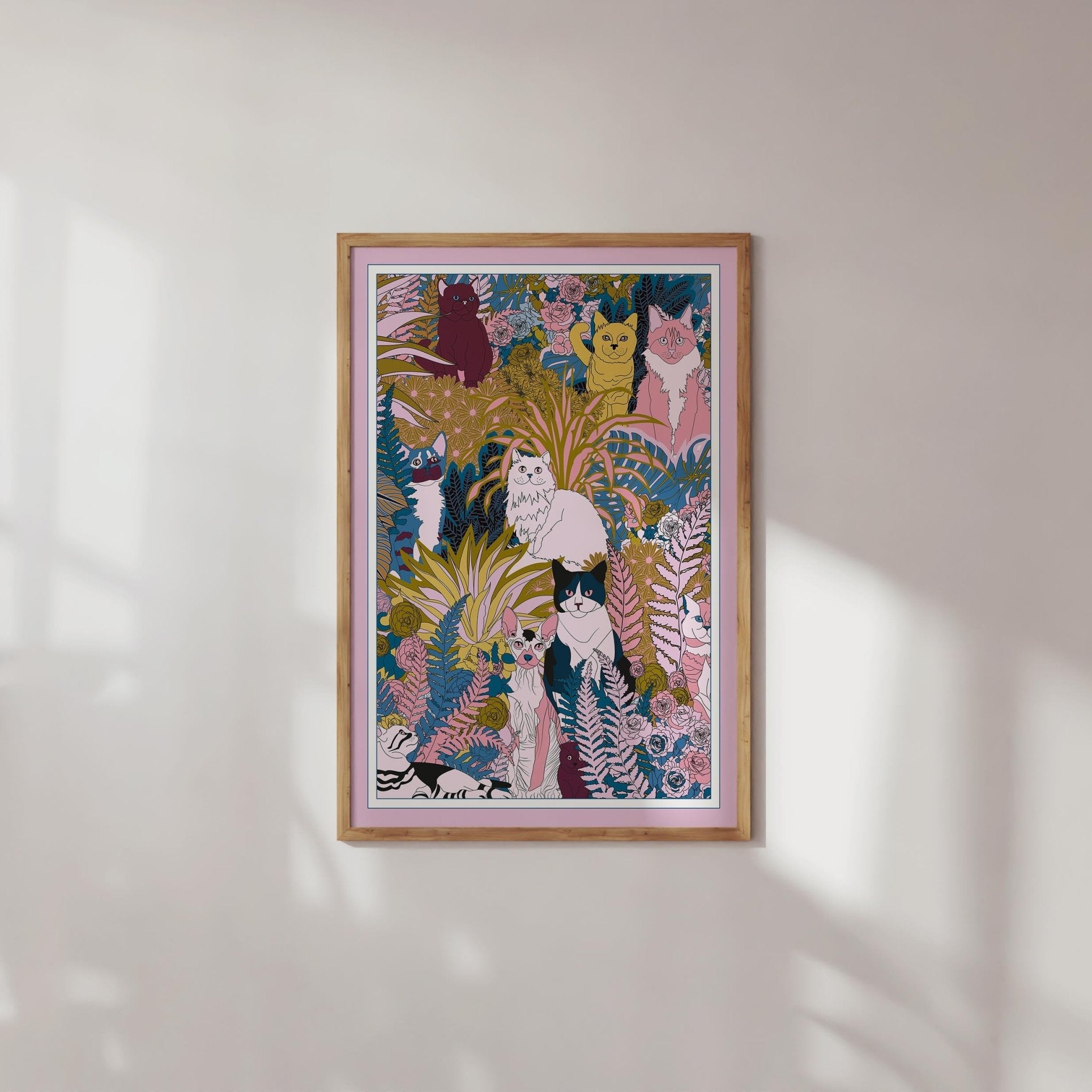 A whimsical art print featuring playful cats and kittens among colorful plants and flowers, perfect for cat lovers.