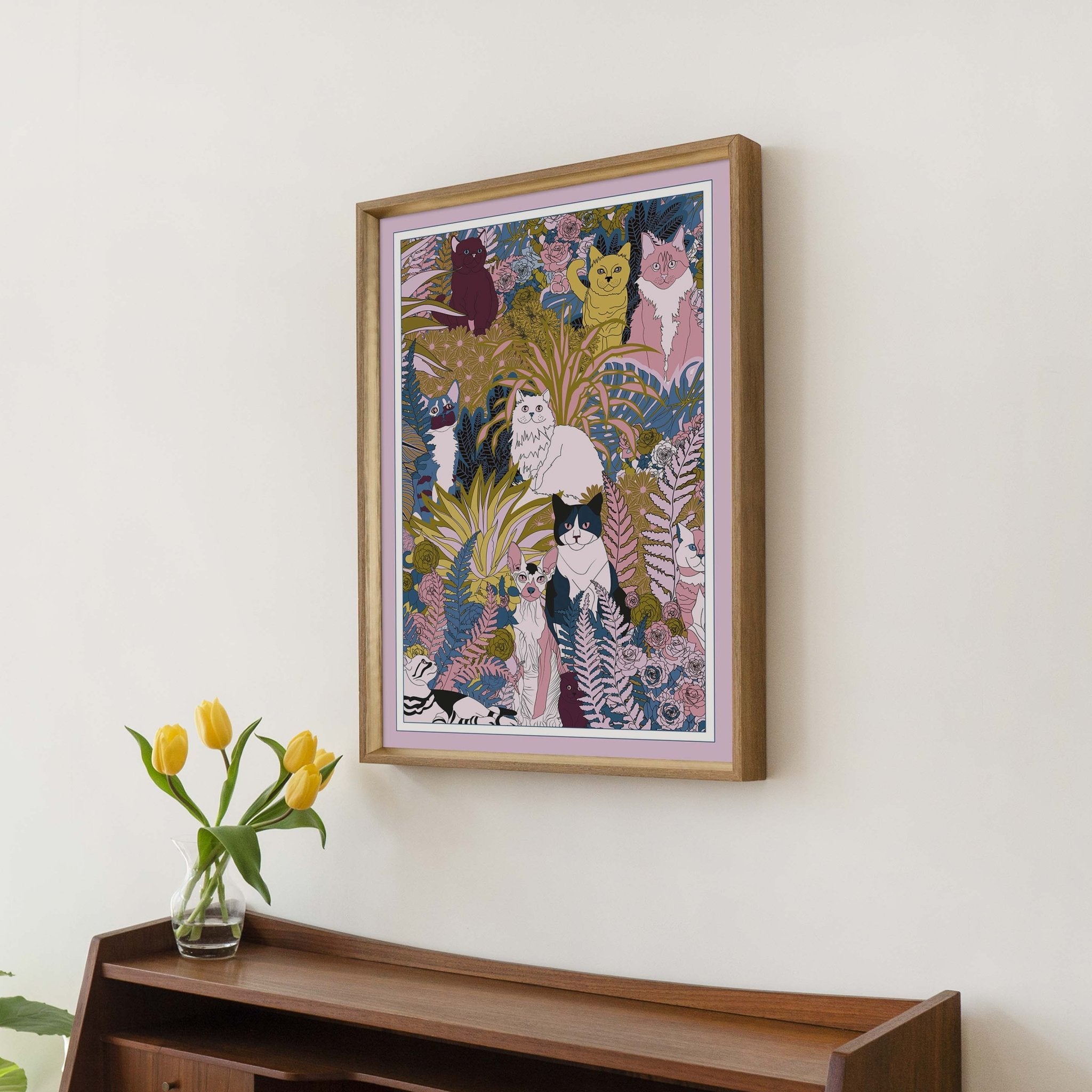 A whimsical art print featuring playful cats and kittens among colorful plants and flowers, perfect for cat lovers.