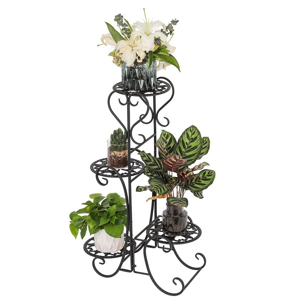 A stylish black metal garden flower stand with four rounded shelves, displaying various potted plants in an outdoor setting.