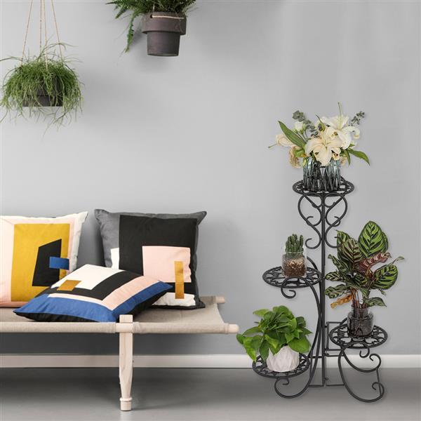 A stylish black metal garden flower stand with four rounded shelves, displaying various potted plants in an outdoor setting.