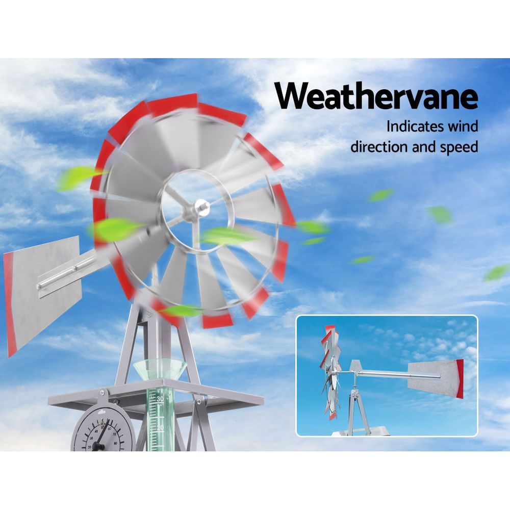 8FT Garden Windmill with grey blades and red trims, featuring a weathervane and sturdy metal frame, set against a garden backdrop.