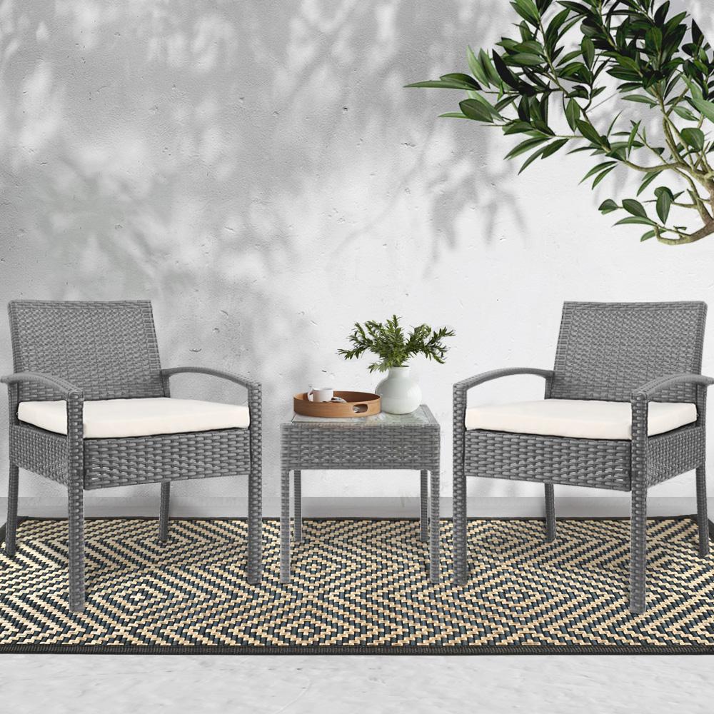 Gardeon 3-piece outdoor set in grey featuring two chairs and a side table with a glass top, showcasing elegant design and comfortable cushions.