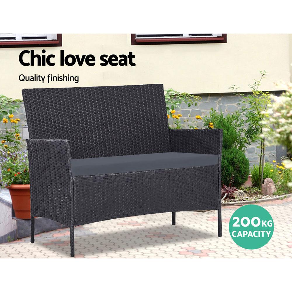 Gardeon 4-piece outdoor lounge setting featuring a chic loveseat, two armchairs, and a matching side table with a glass top, set in a stylish outdoor environment.