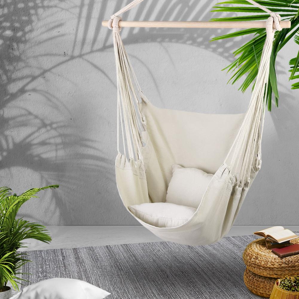 Gardeon Hammock Swing Chair in cream color with matching cushions, hanging from a timber rail, suitable for indoor and outdoor use.