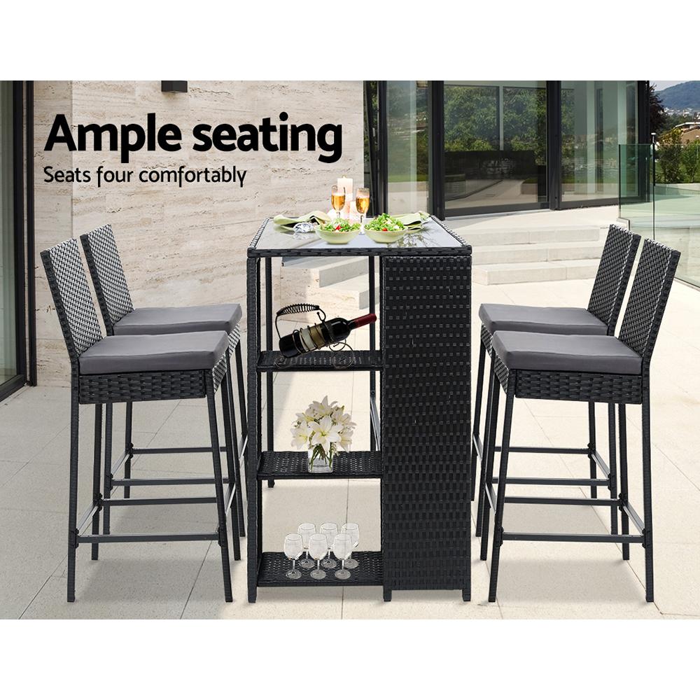 Gardeon Outdoor Bar Set featuring a stylish table and four wicker stools with grey cushions, perfect for outdoor dining.