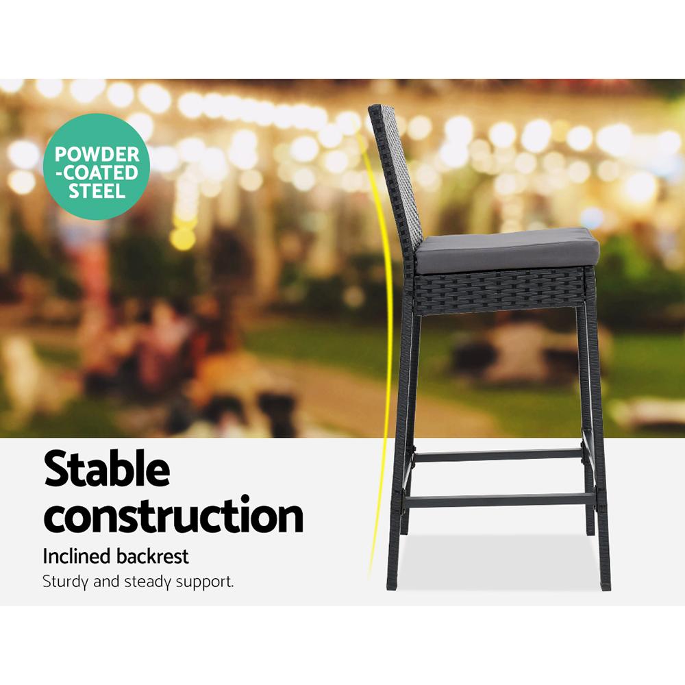 Gardeon Outdoor Bar Set featuring a stylish table and four wicker stools with grey cushions, perfect for outdoor dining.