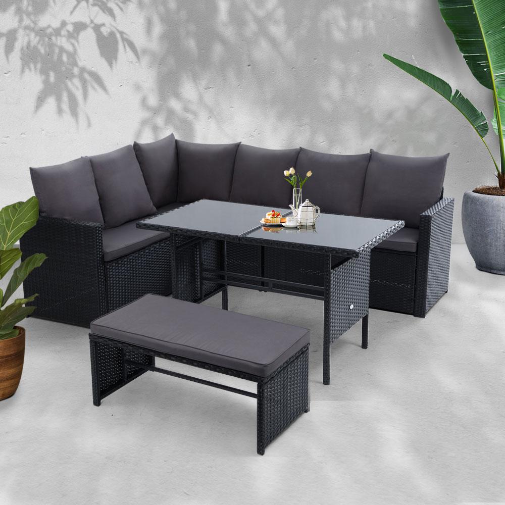 Gardeon Outdoor Furniture Dining Setting Sofa Set featuring a stylish 9-seater arrangement with dark grey cushions and black wicker finish.