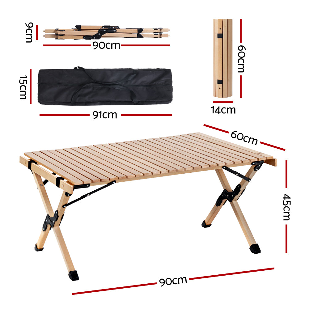 Gardeon Outdoor Furniture Wooden Egg Roll Picnic Table set up in a natural outdoor setting, showcasing its beech wood finish and lightweight design.