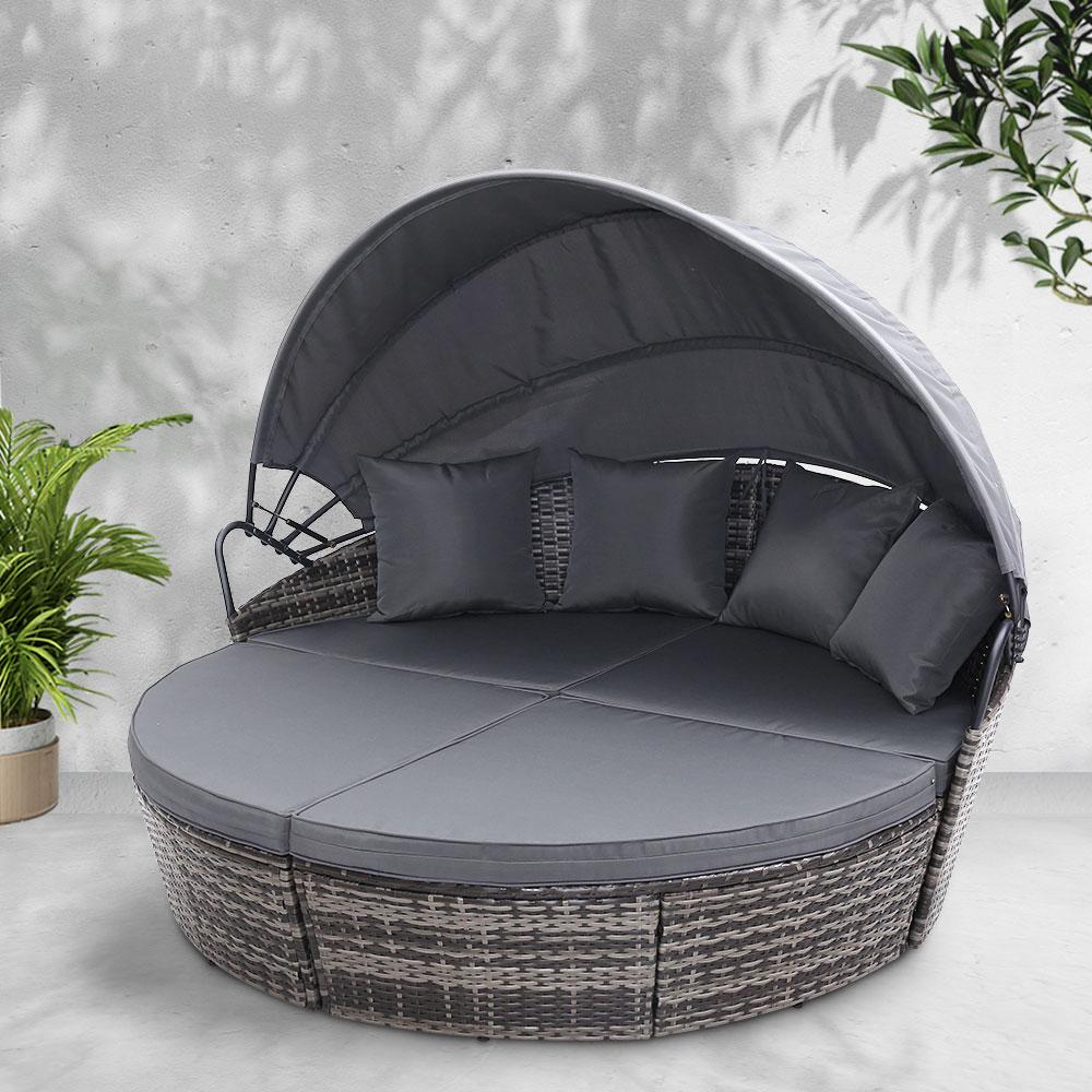 Gardeon Outdoor Lounge Setting featuring a modular design with plush cushions and a folding canopy, perfect for outdoor relaxation.