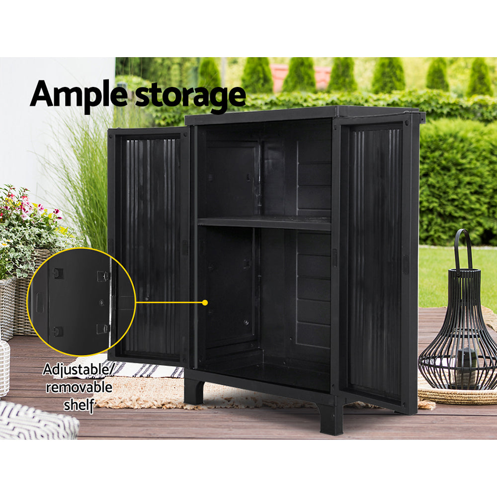 Gardeon Outdoor Storage Cabinet in a garden setting, showcasing its stylish design and lockable doors.