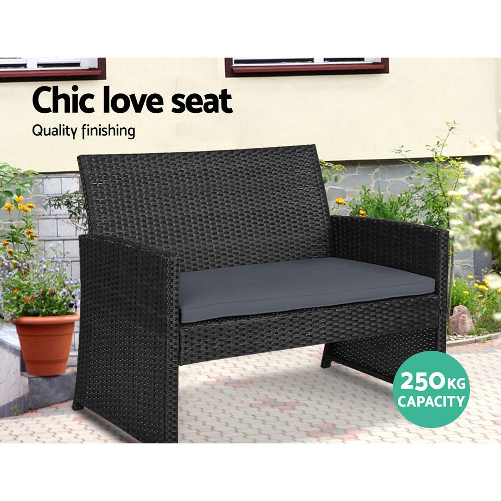 Gardeon Rattan Furniture Outdoor Lounge Setting featuring two armchairs, a two-seater sofa, and a glass-topped table in a stylish black and grey design.