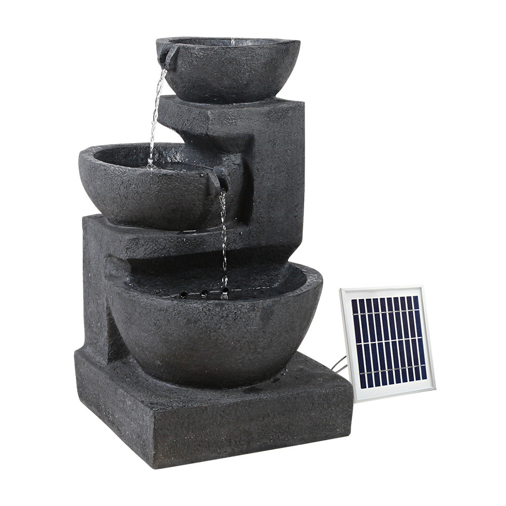 Gardeon Solar Fountain with LED lights, featuring a three-tier design and vibrant blue color, set in a garden environment.