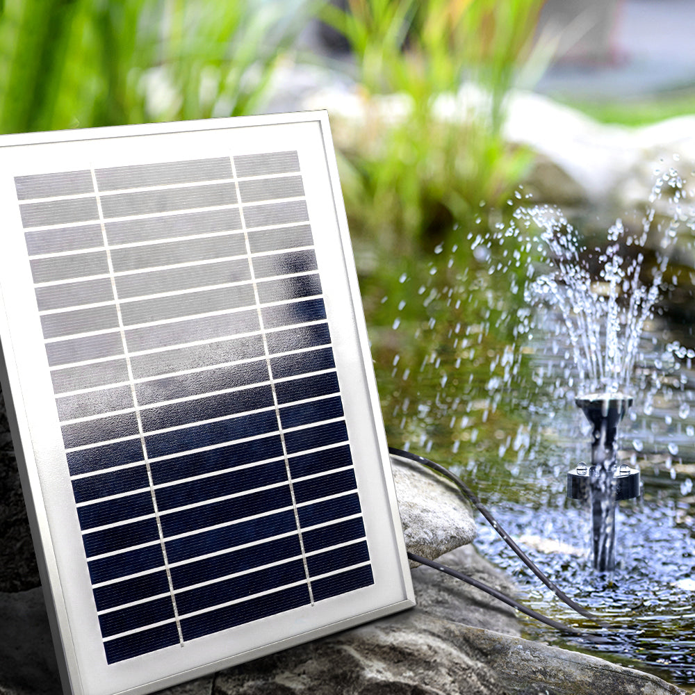 Gardeon Solar Pond Pump with Battery Kit, featuring solar panels and water fountain in a garden setting.