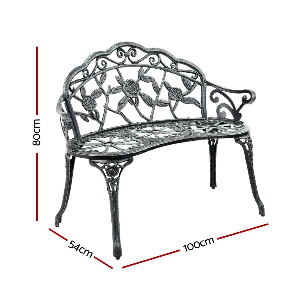 Gardeon Victorian Garden Bench in green with ornate aluminum seat and floral-patterned backrest, set against a garden backdrop.