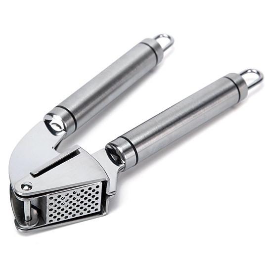 Stainless steel Garlic Press PRO with silicone peeler and cleaning brush, designed for easy garlic mincing.