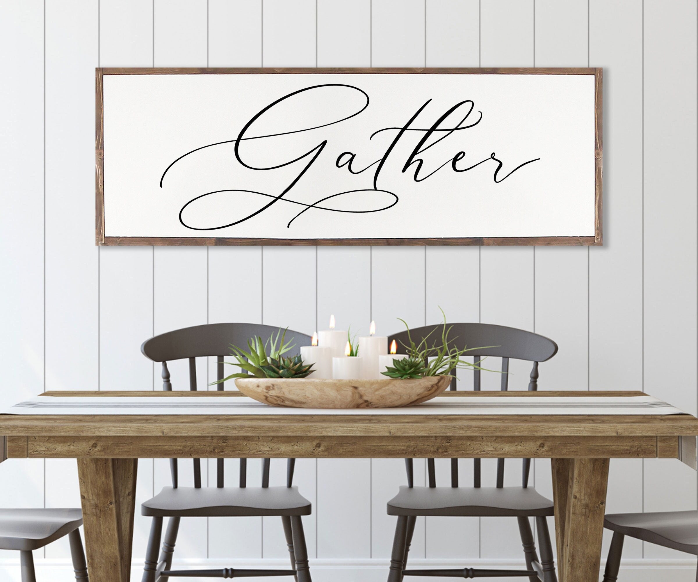 Gather Sign featuring a rustic wood design with the quote 'Bless the food before us' framed in a customizable color.