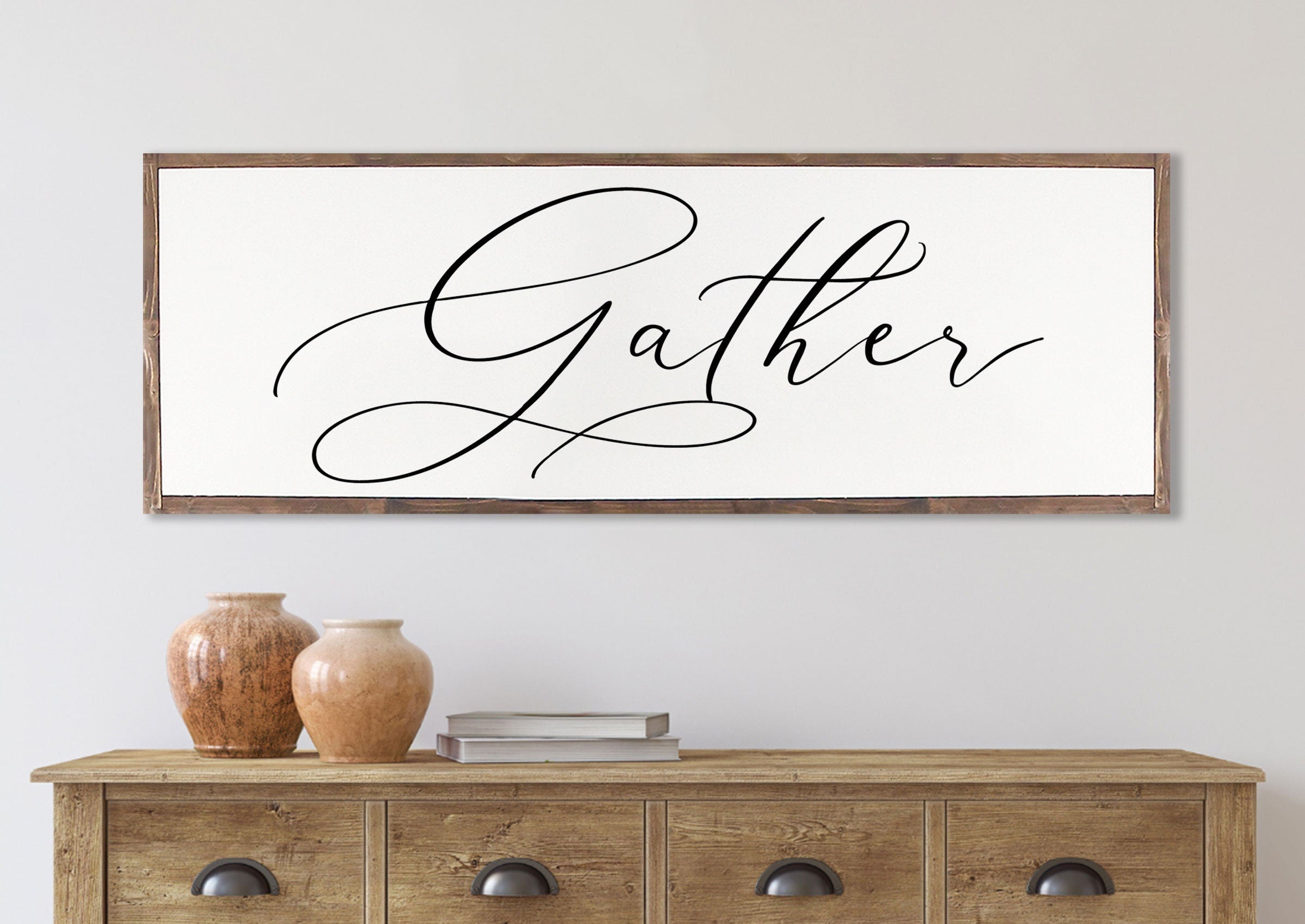 Gather Sign featuring a rustic wood design with the quote 'Bless the food before us' framed in a customizable color.