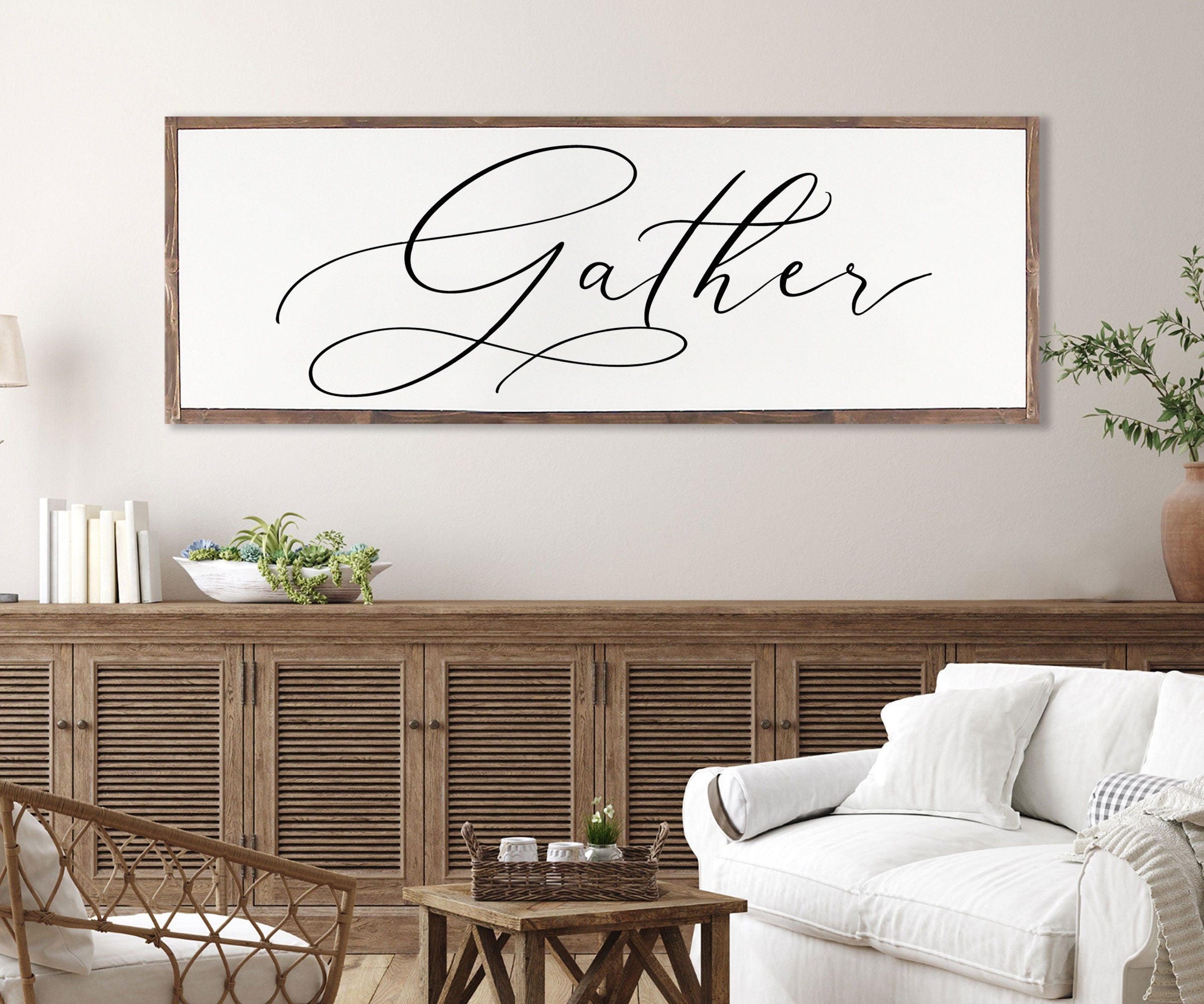 Gather Sign featuring a rustic wood design with the quote 'Bless the food before us' framed in a customizable color.