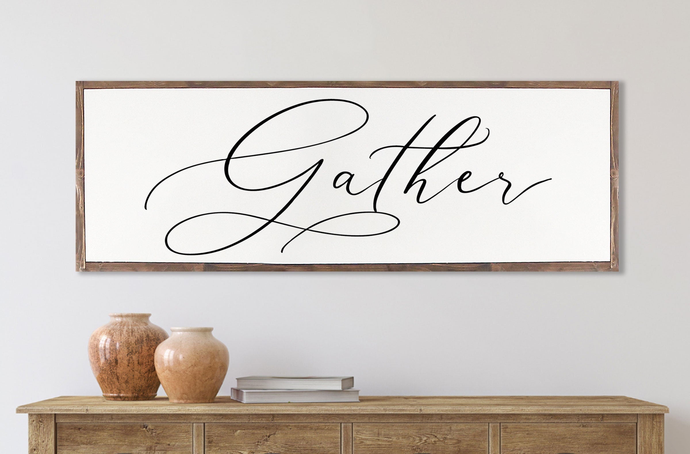 Gather Sign featuring a rustic wood design with the quote 'Bless the food before us' framed in a customizable color.