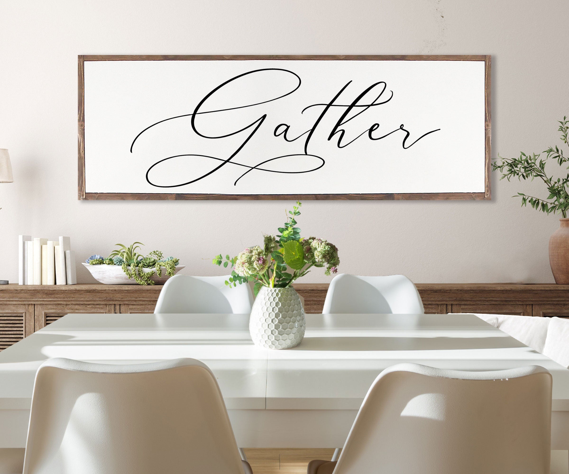 Gather Sign featuring a rustic wood design with the quote 'Bless the food before us' framed in a customizable color.