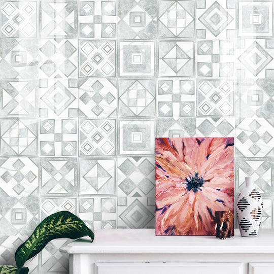 Geometric pattern staircase wall tile stickers displayed on a kitchen backsplash, showcasing their vibrant design and glossy finish.