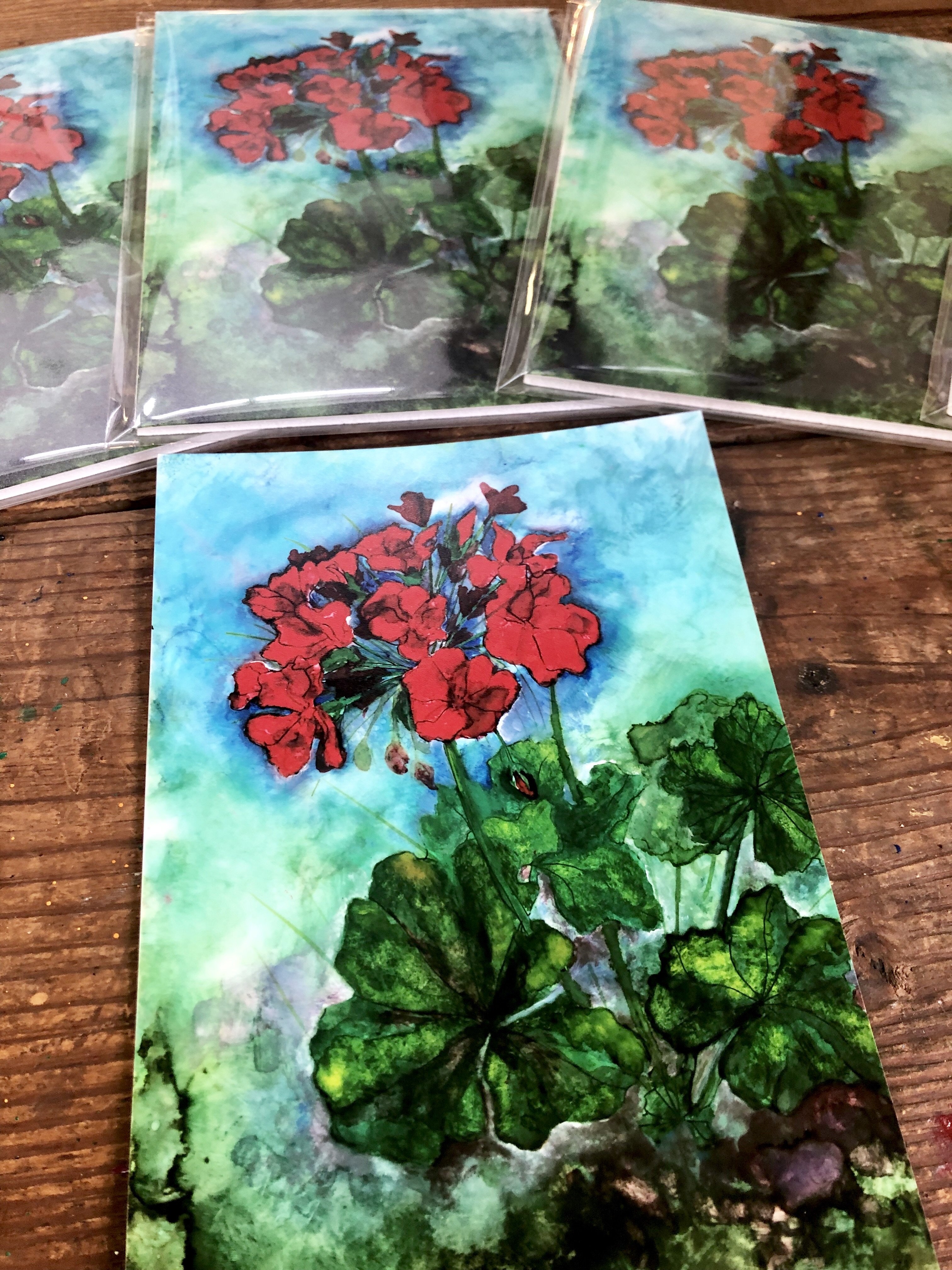 A vibrant red geranium print showcasing intricate details and glossy finish, perfect for home decor.