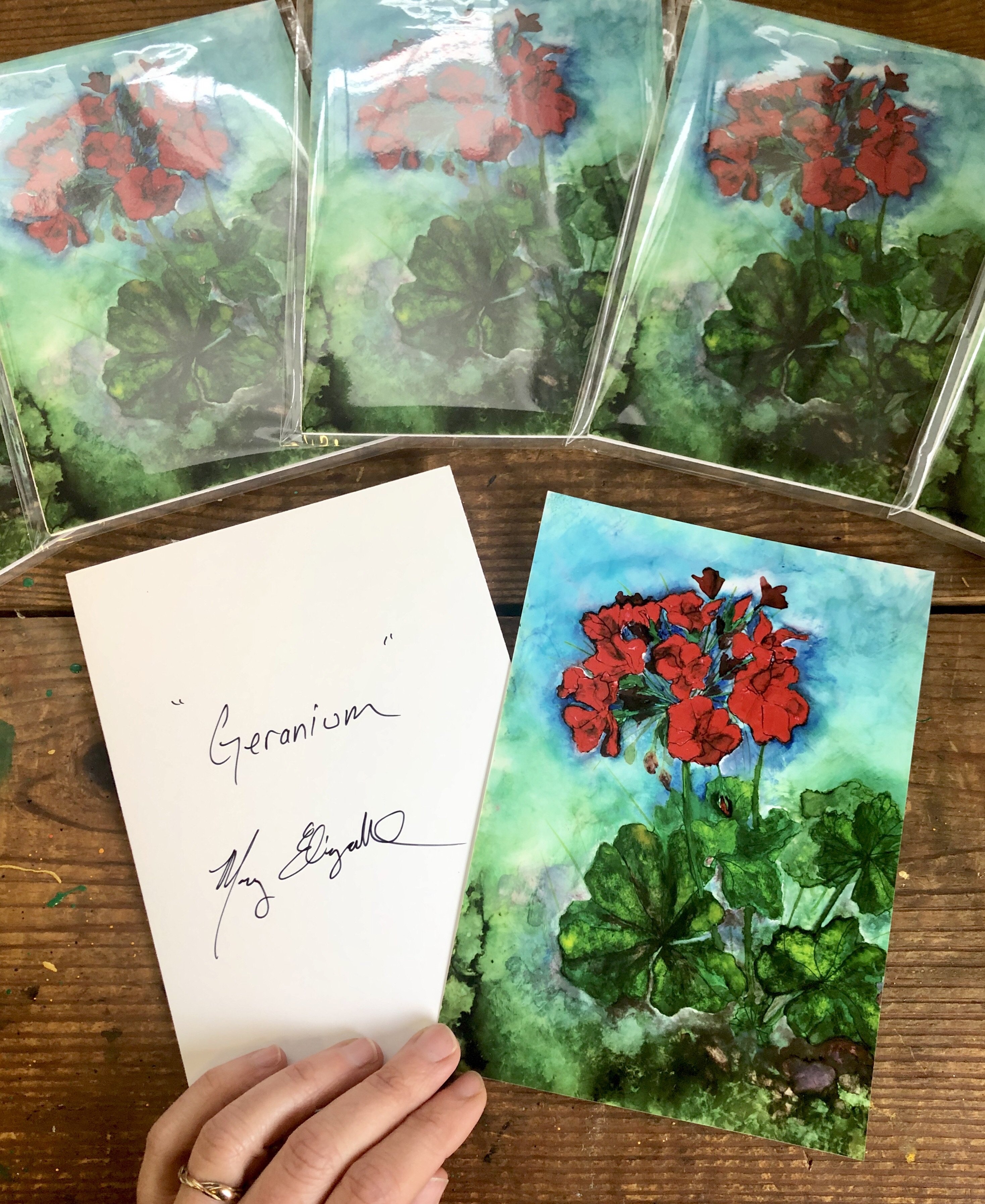 A vibrant red geranium print showcasing intricate details and glossy finish, perfect for home decor.