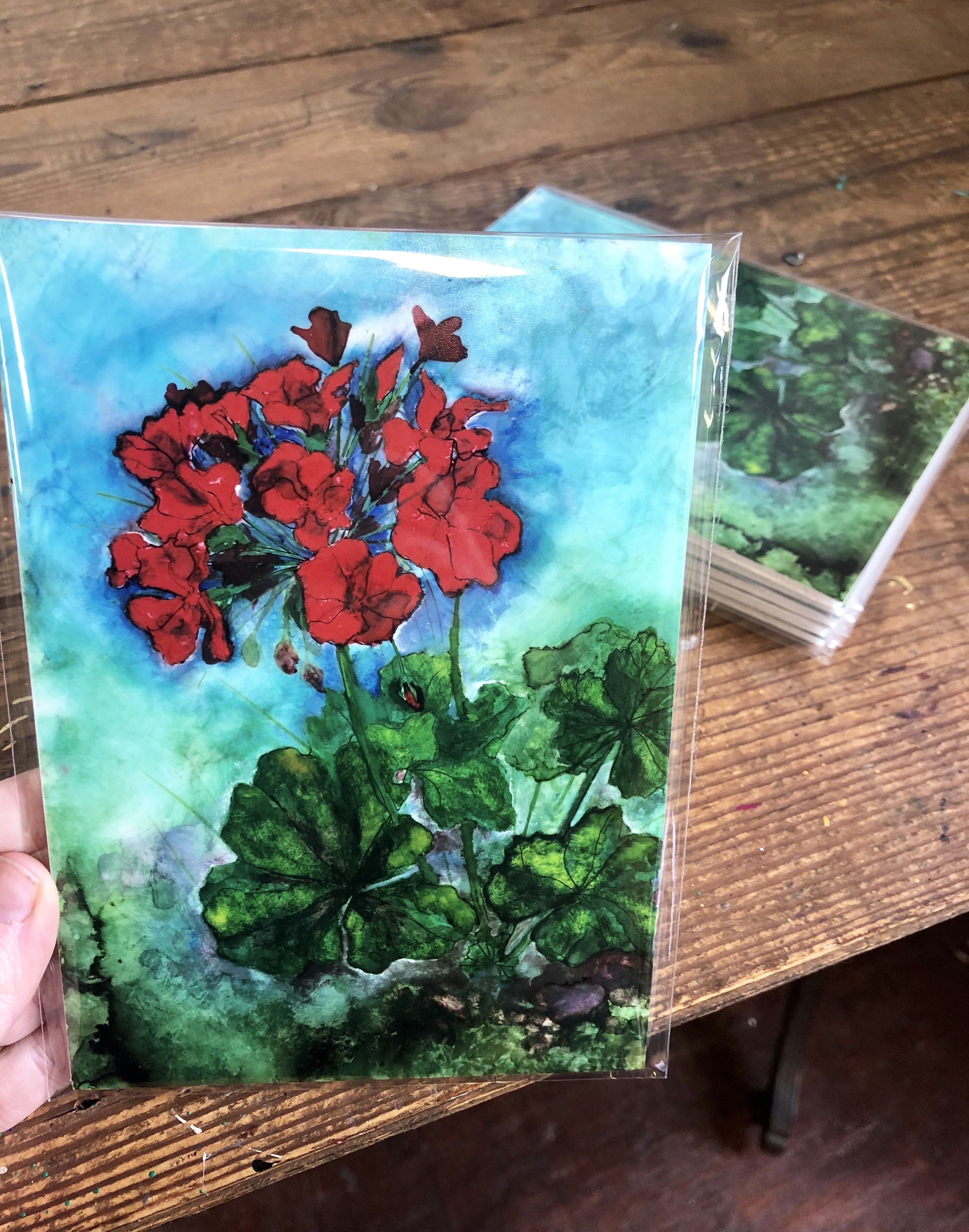 A vibrant red geranium print showcasing intricate details and glossy finish, perfect for home decor.