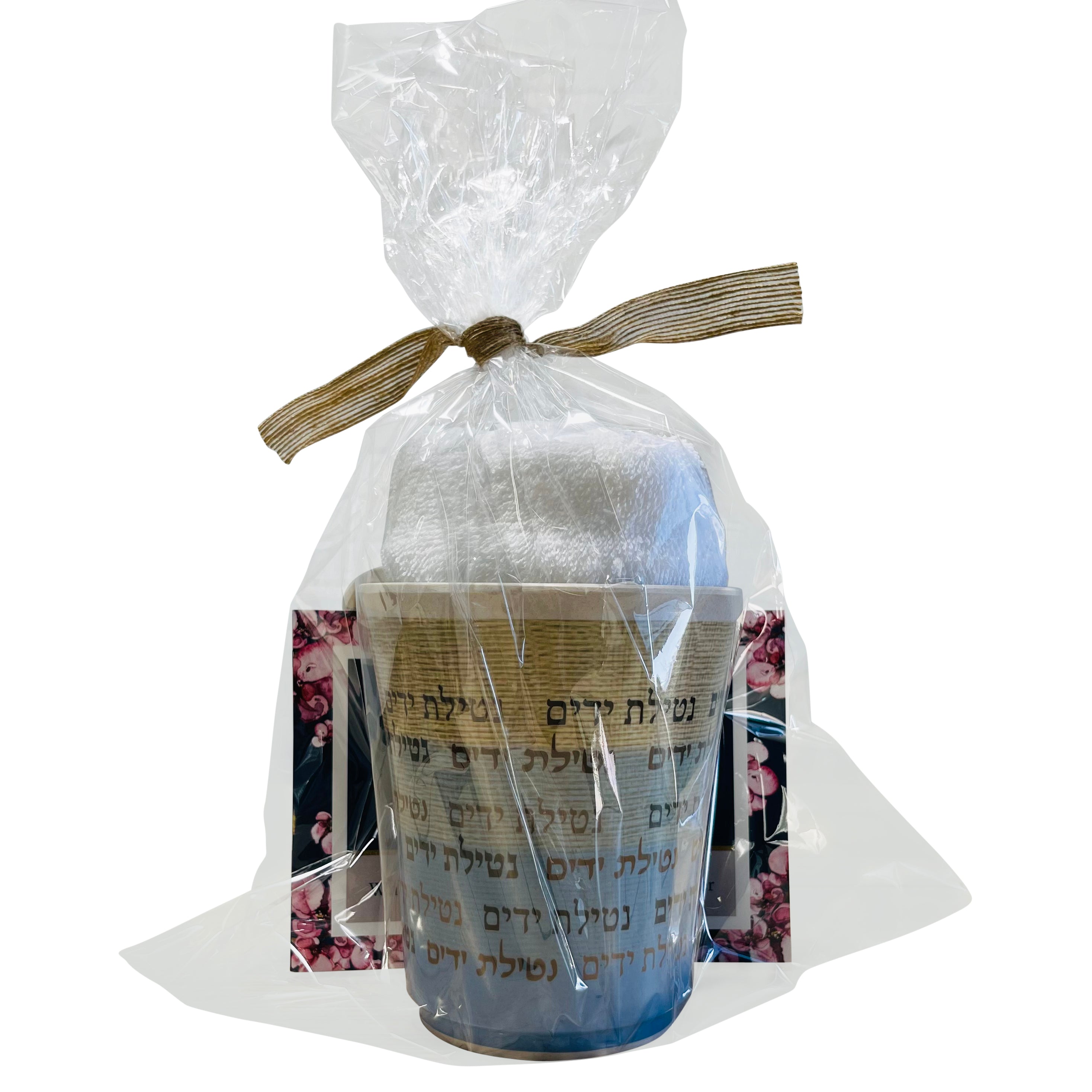 Elegant gift basket containing a bamboo washing cup and three embroidered hand towels, beautifully arranged.