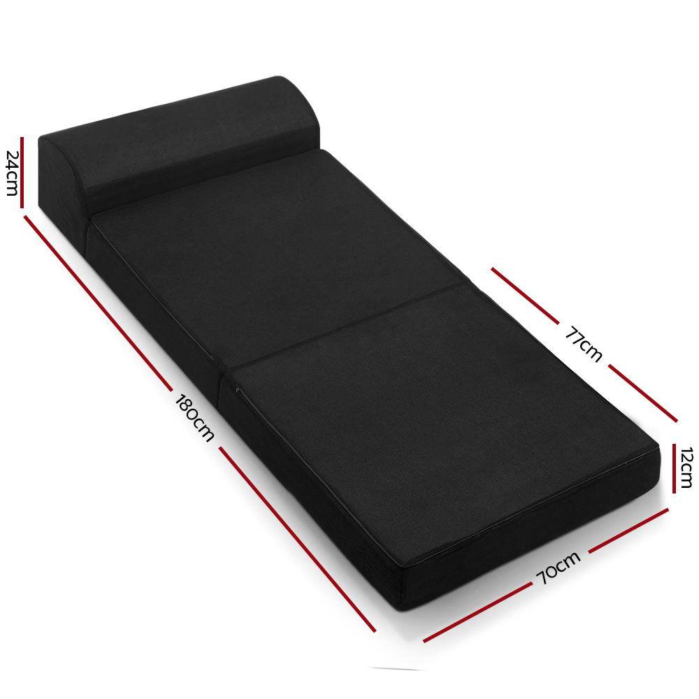 Giselle Bedding Folding Foam Mattress in black, showcasing its dual functionality as a sofa and bed, with a removable cover.