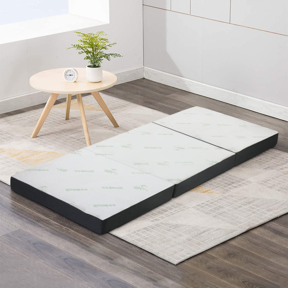 Giselle Bedding Folding Foam Portable Mattress with bamboo fabric, showcasing its foldable design and removable cover.