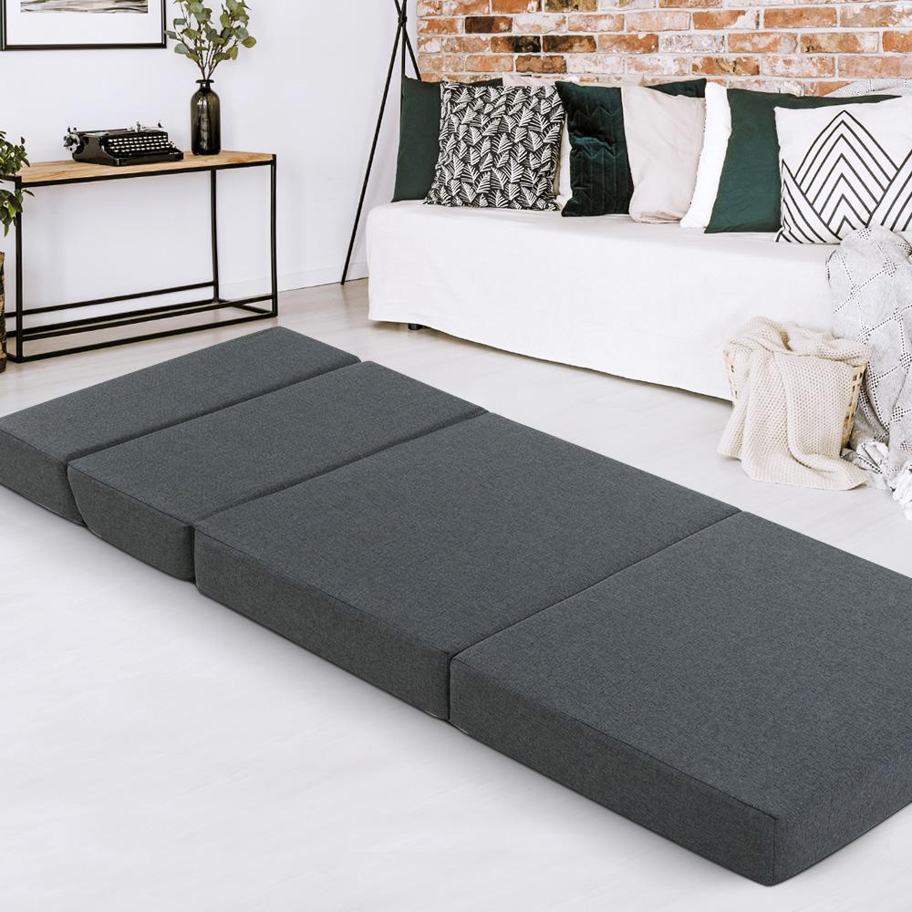 Giselle Bedding Folding Mattress in dark grey, showcasing its foldable design and removable cover.