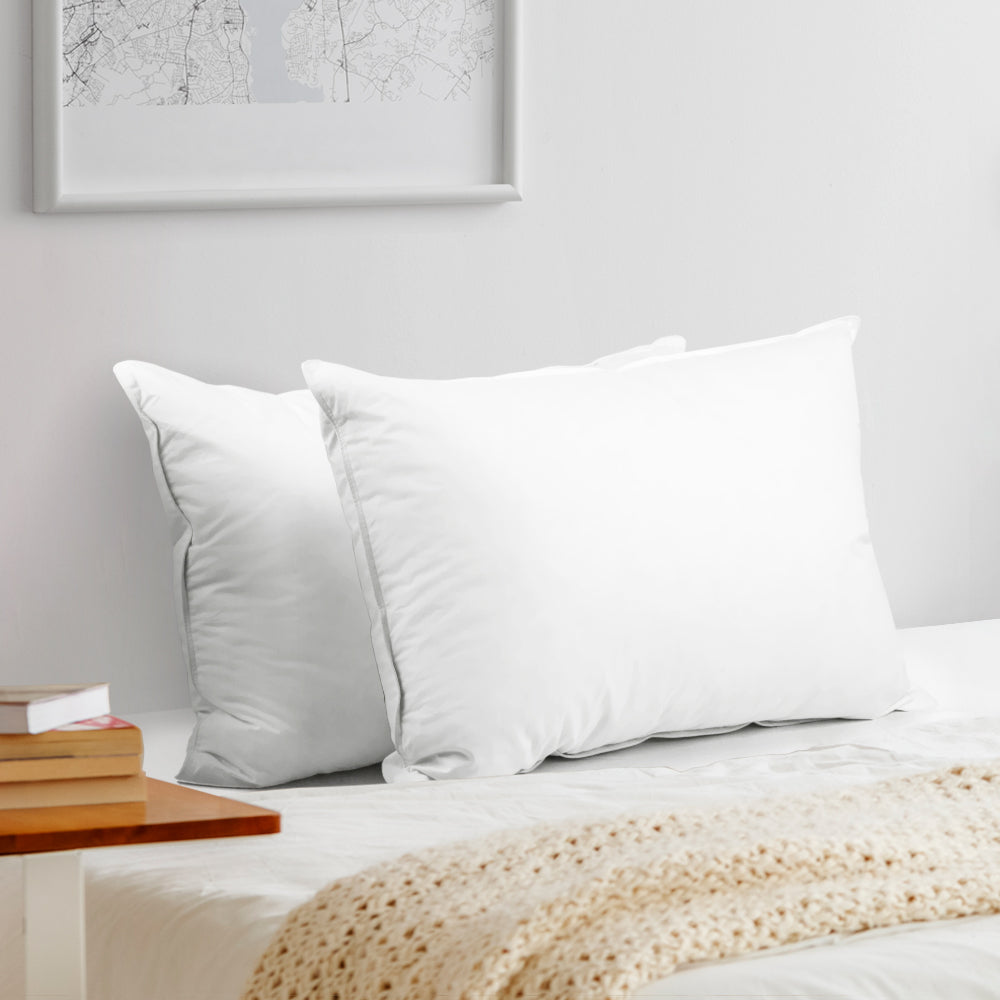 Giselle Bedding Set of 2 Goose Feather and Down Pillows in white, showcasing their soft and plush design.