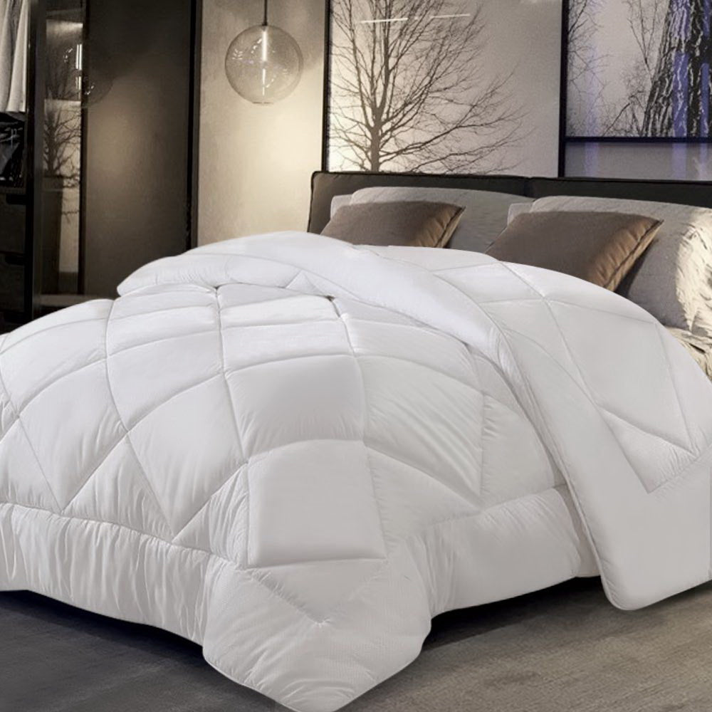 Giselle Bedding Super King 800GSM Microfibre Bamboo Quilt displayed on a bed, showcasing its luxurious white microfibre cover and diamond-stitch design.