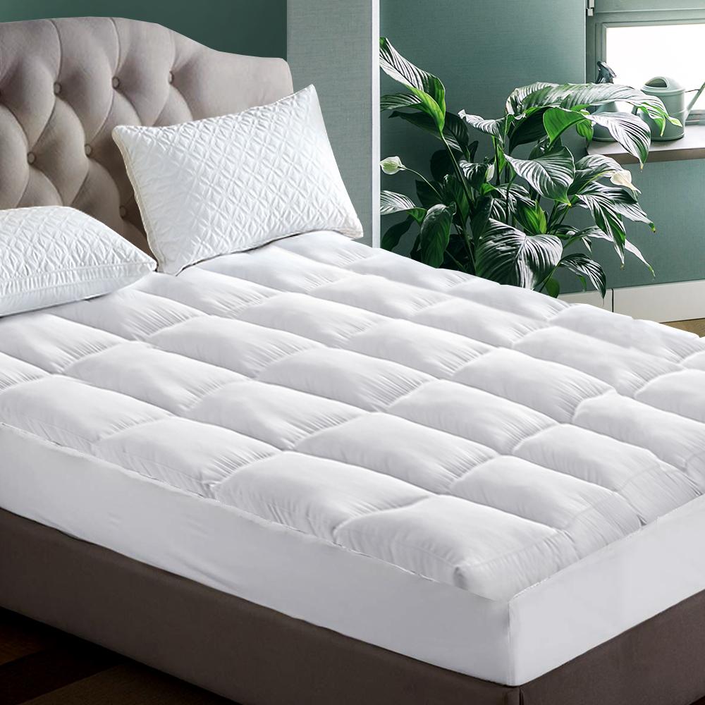 Giselle Queen Mattress Topper with 1000GSM microfibre filling, showcasing its plush surface and fitted elastic skirt.