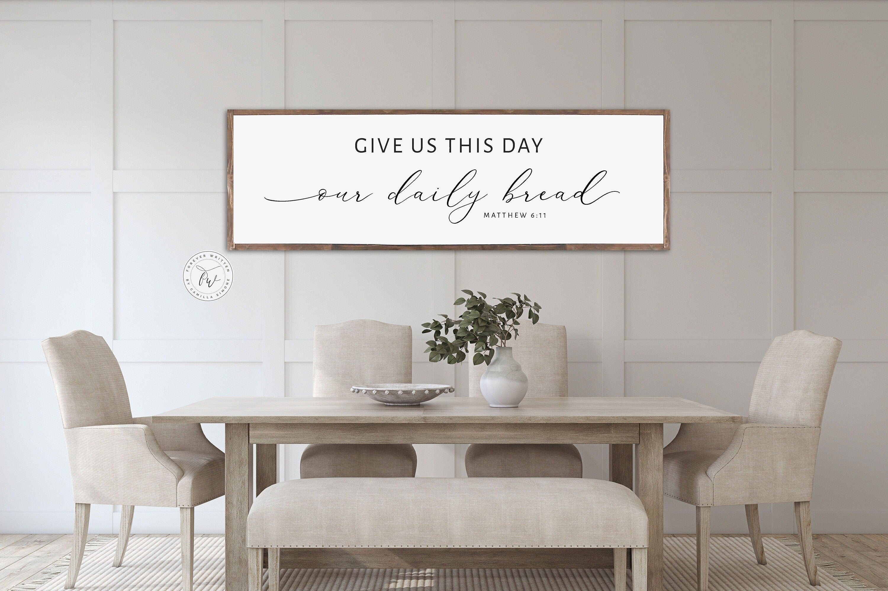 Rustic handmade wood sign featuring the verse 'Give Us This Day Our Daily Bread' from Matthew 6:11, framed and stained in customizable colors.