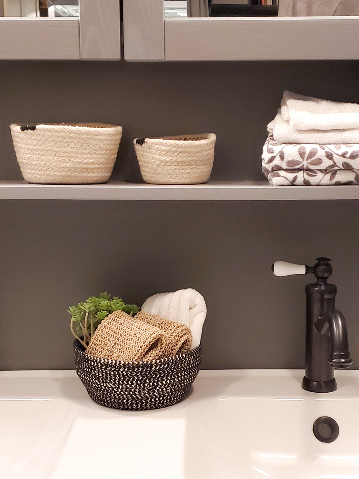 Set of two handcrafted black and gold glitter bowls made from braided jute and golden yarn, perfect for stylish storage.