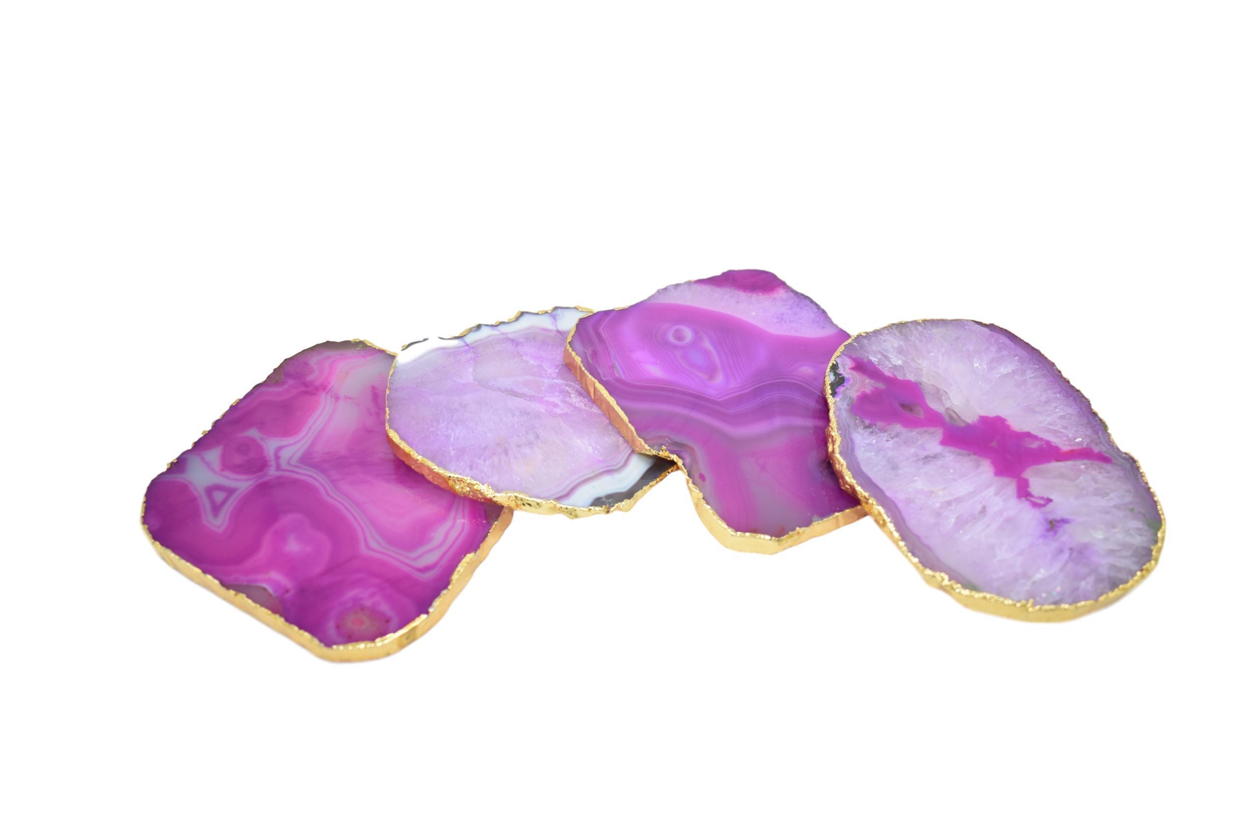 Set of four gnarled agate coasters with gold trim, showcasing unique natural patterns and vibrant colors.