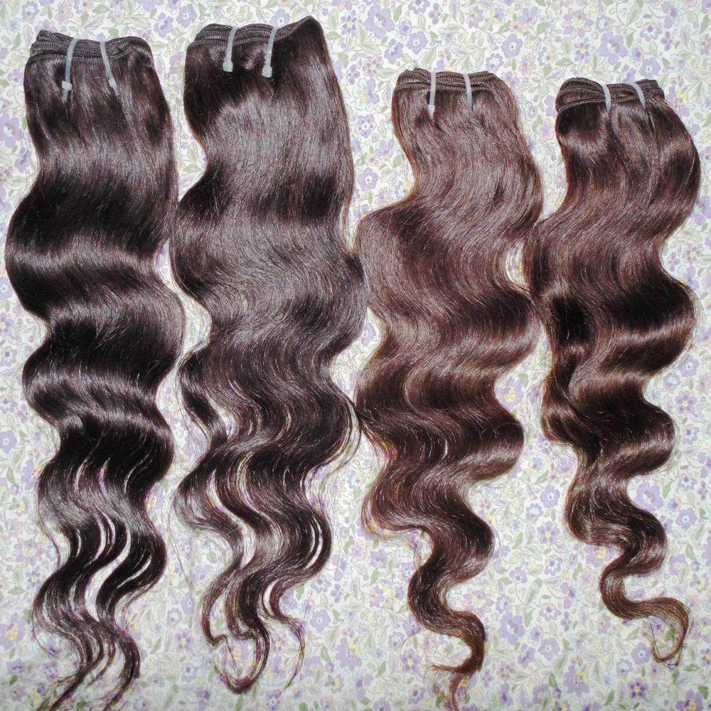 A bundle of cheap Peruvian wavy processed human hair extensions in brown color, showcasing the body wave texture and various lengths.