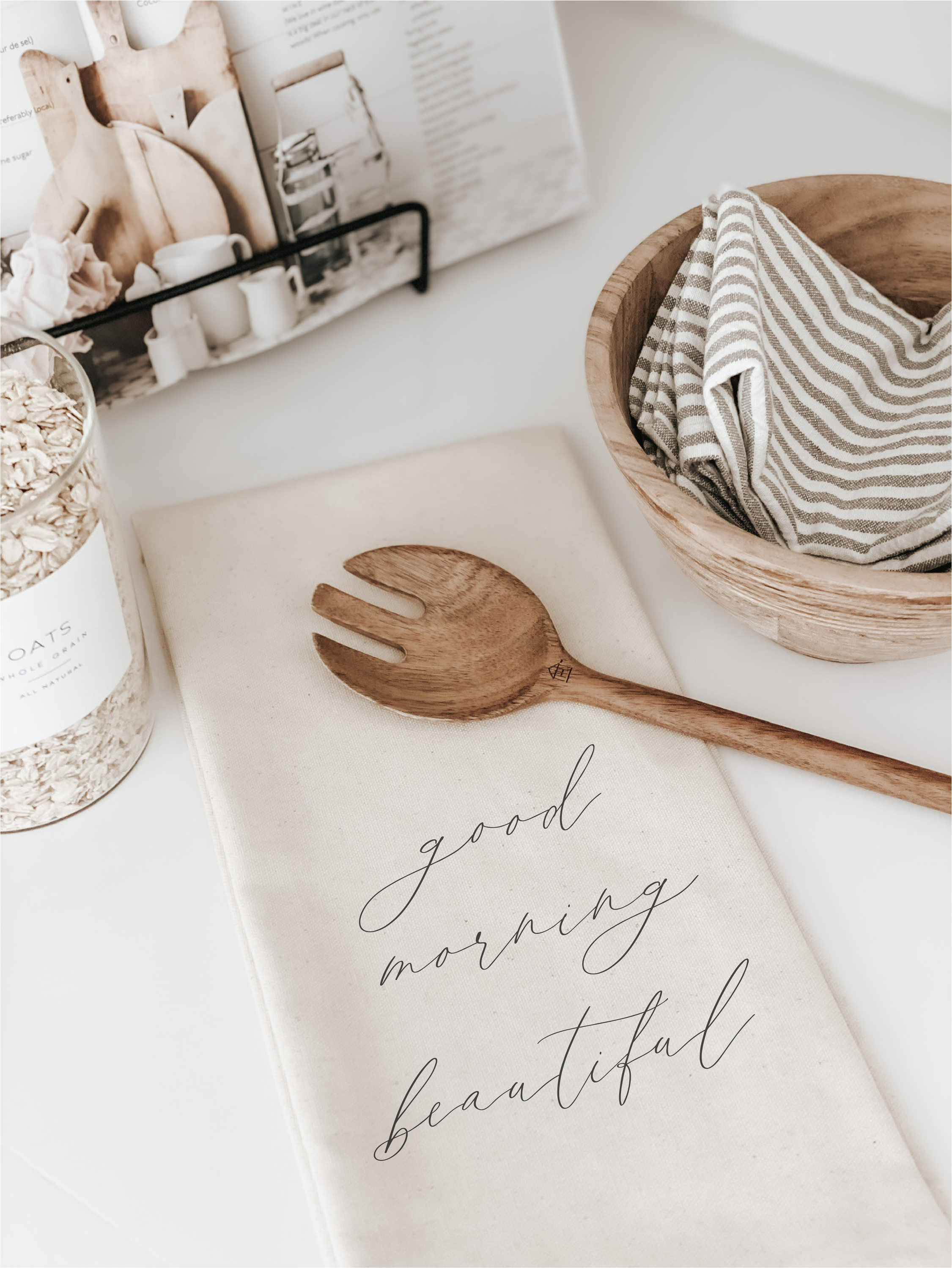 A beautiful kitchen towel featuring the phrase 'Good Morning Beautiful', made from organic cotton in white and natural colors.