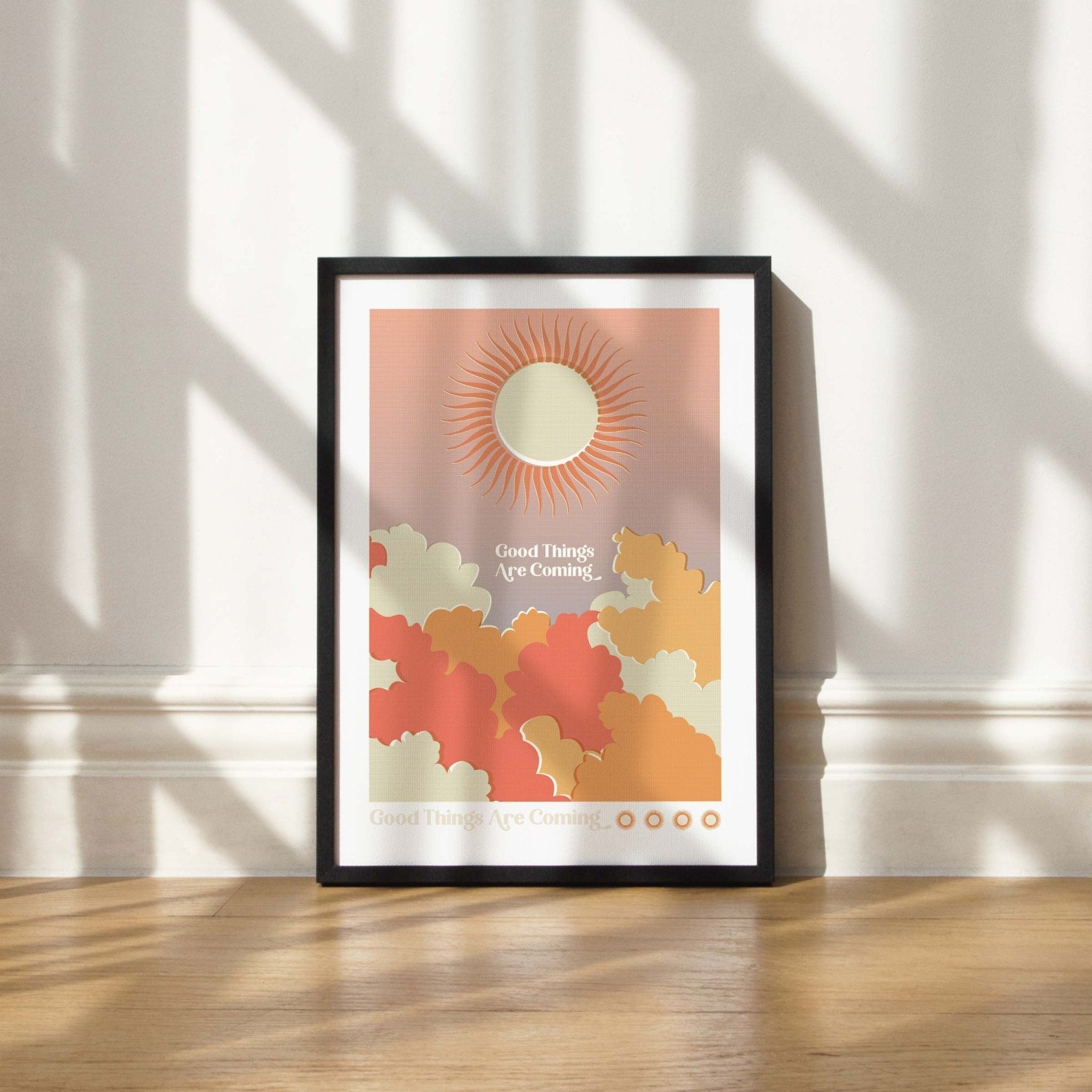 Good Things Are Coming art print featuring retro word art with sun and cloud imagery in warm colors.