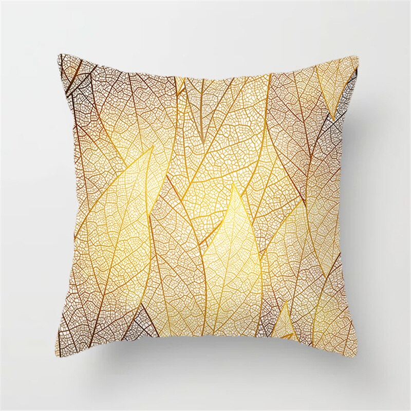 Gold Leaf Cushion Cover showcasing an elegant gold leaf pattern on a soft polyester fabric, perfect for home decor.