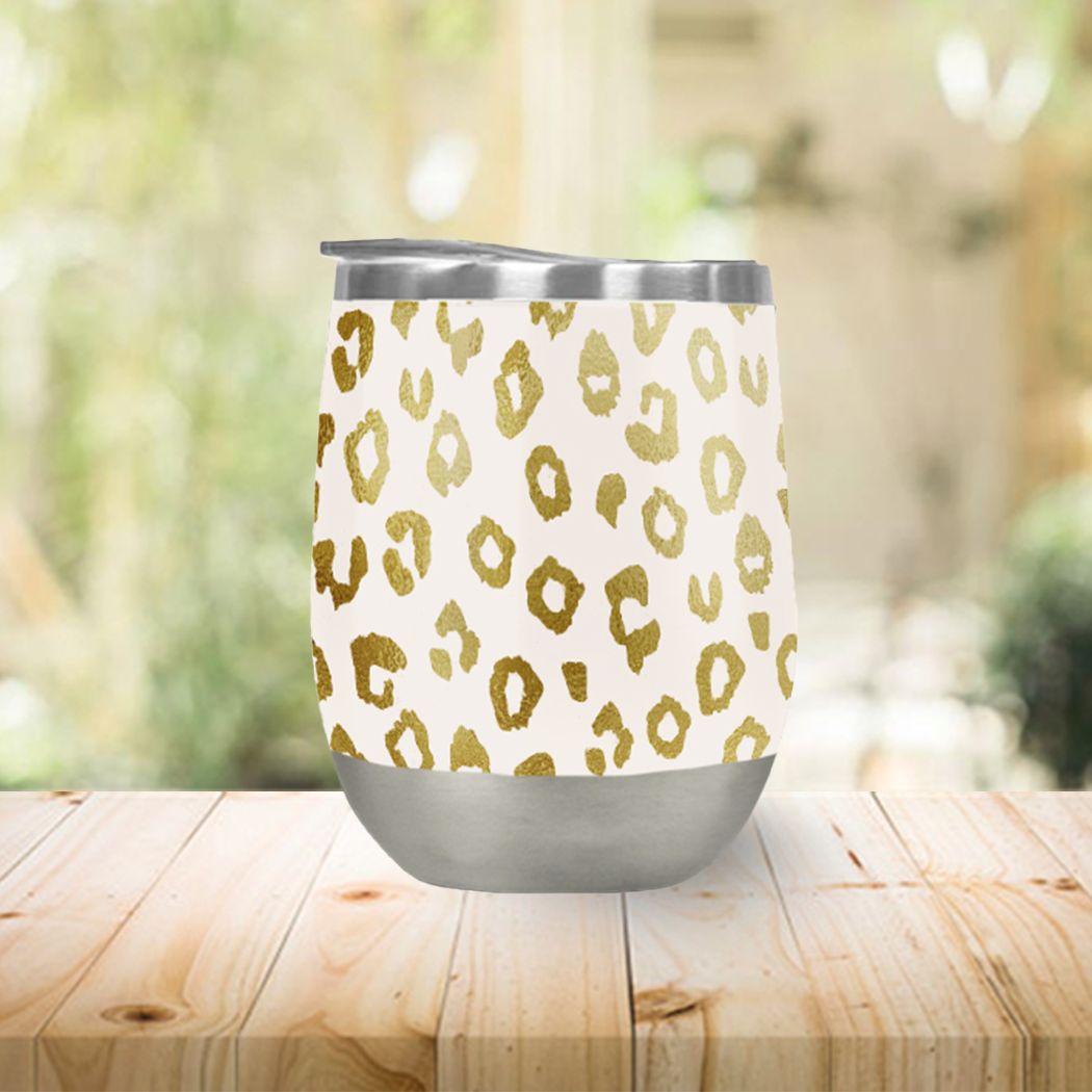 Gold leopard print wine tumbler with double-wall insulation, perfect for outdoor use.