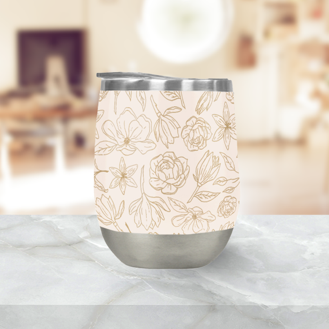 Gold Magnolia Wine Tumbler with double-wall insulation, perfect for outdoor use.