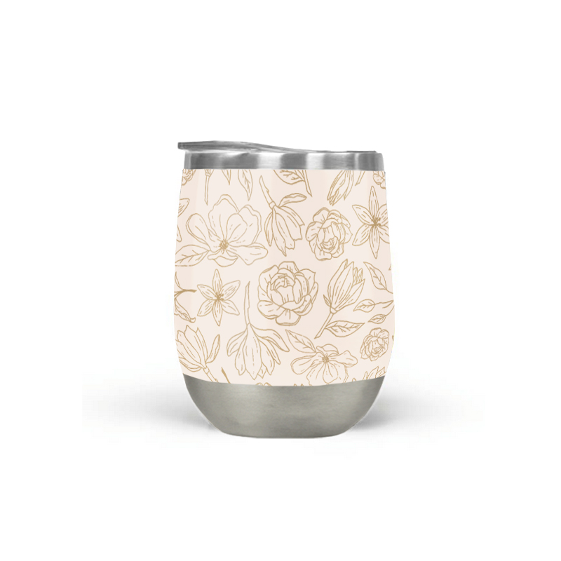 Gold Magnolia Wine Tumbler with double-wall insulation, perfect for outdoor use.