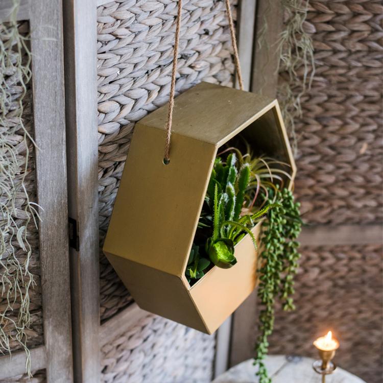 Gold Metal Hexagon Hanging Planter showcasing its modern design and durable construction, perfect for indoor and outdoor decor.