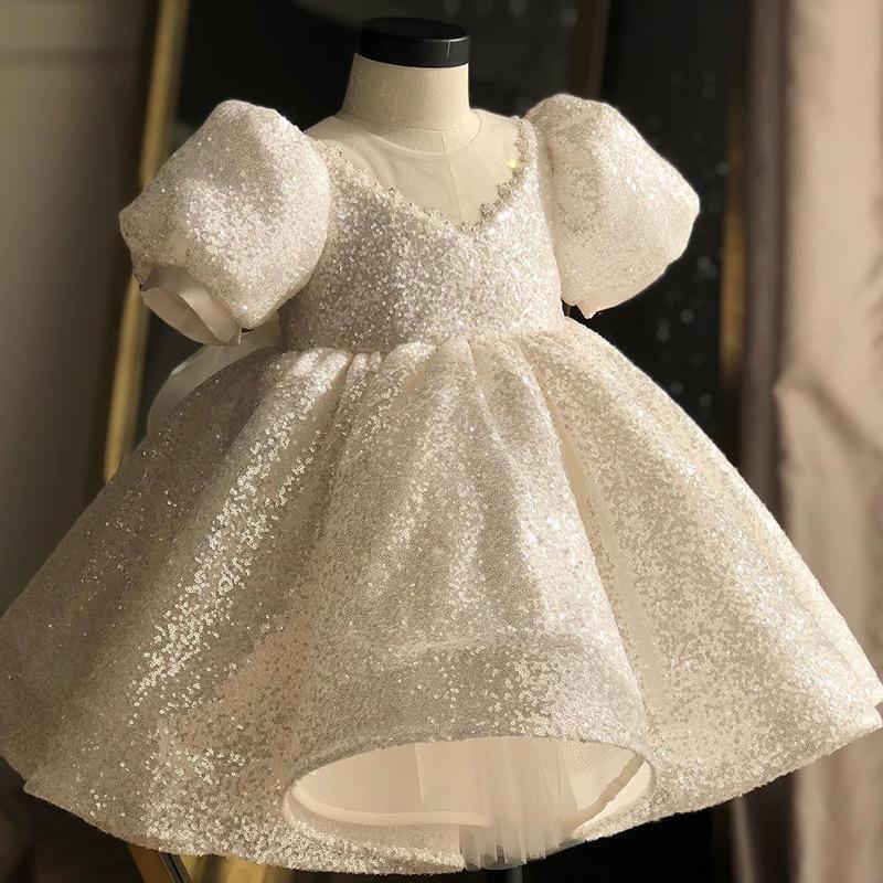 Gorgeous high low beaded little girls pageant dress featuring a tiered backless design, perfect for special occasions.