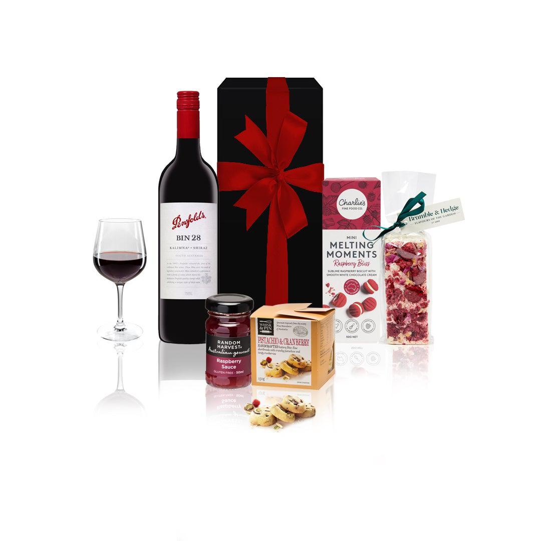 Gourmet Penfold Hamper featuring premium wine and gourmet snacks in an elegant black box with a red bow.